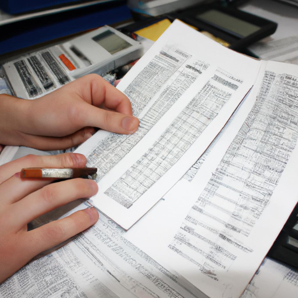 Person holding financial documents, calculating